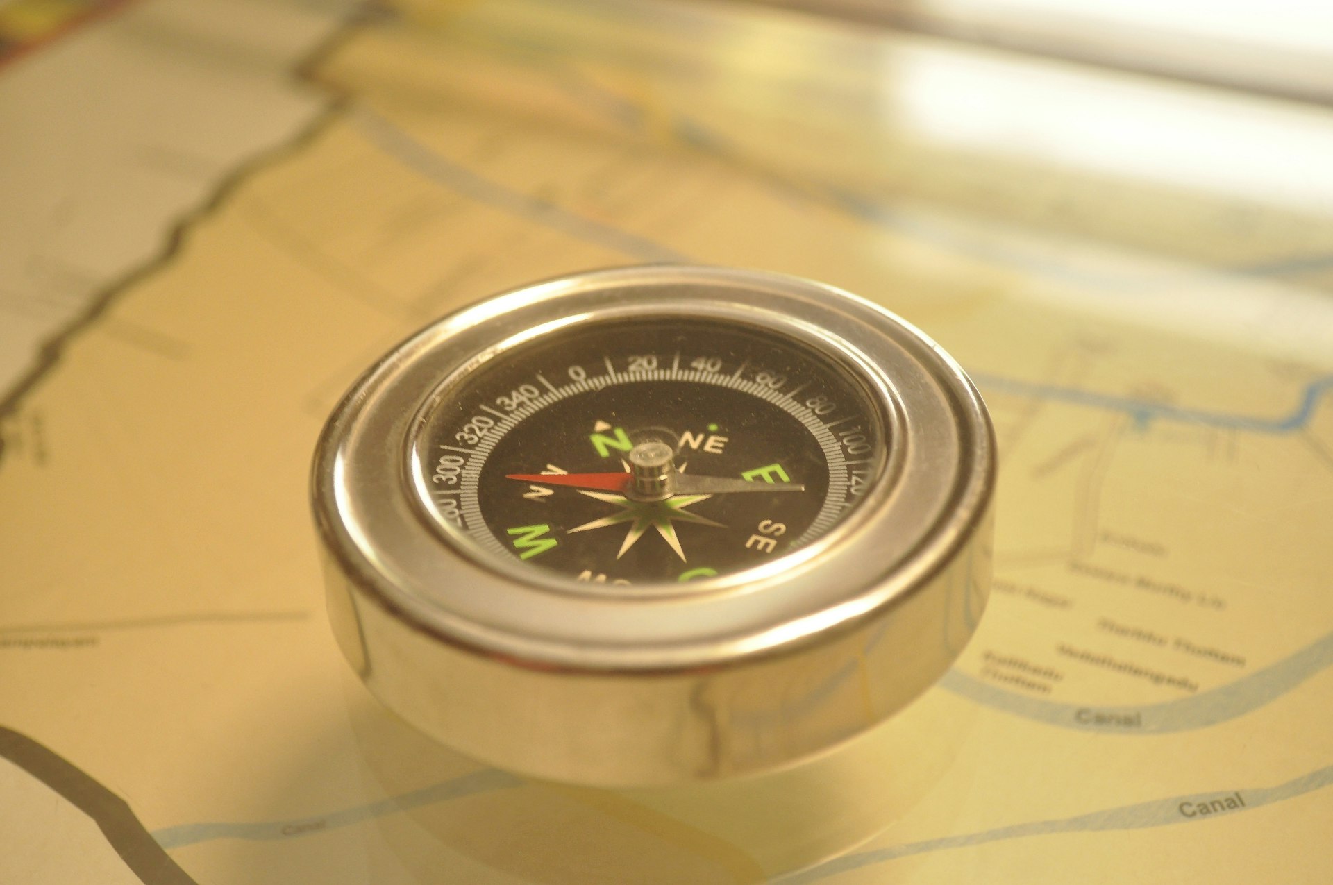 a close up of a compass on a map